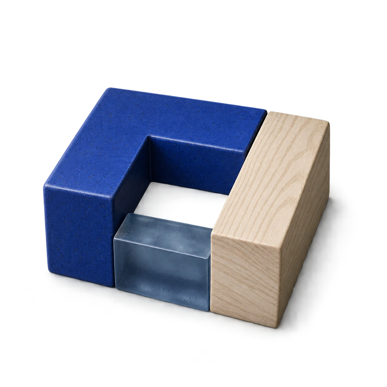 Three differently shaped pieces of blue ceramic, pale wood and translucent slate fit around a shared opening.